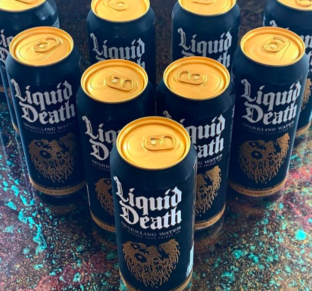 buzzfeed writer&#x27;s black and gold cans of Liquid Death