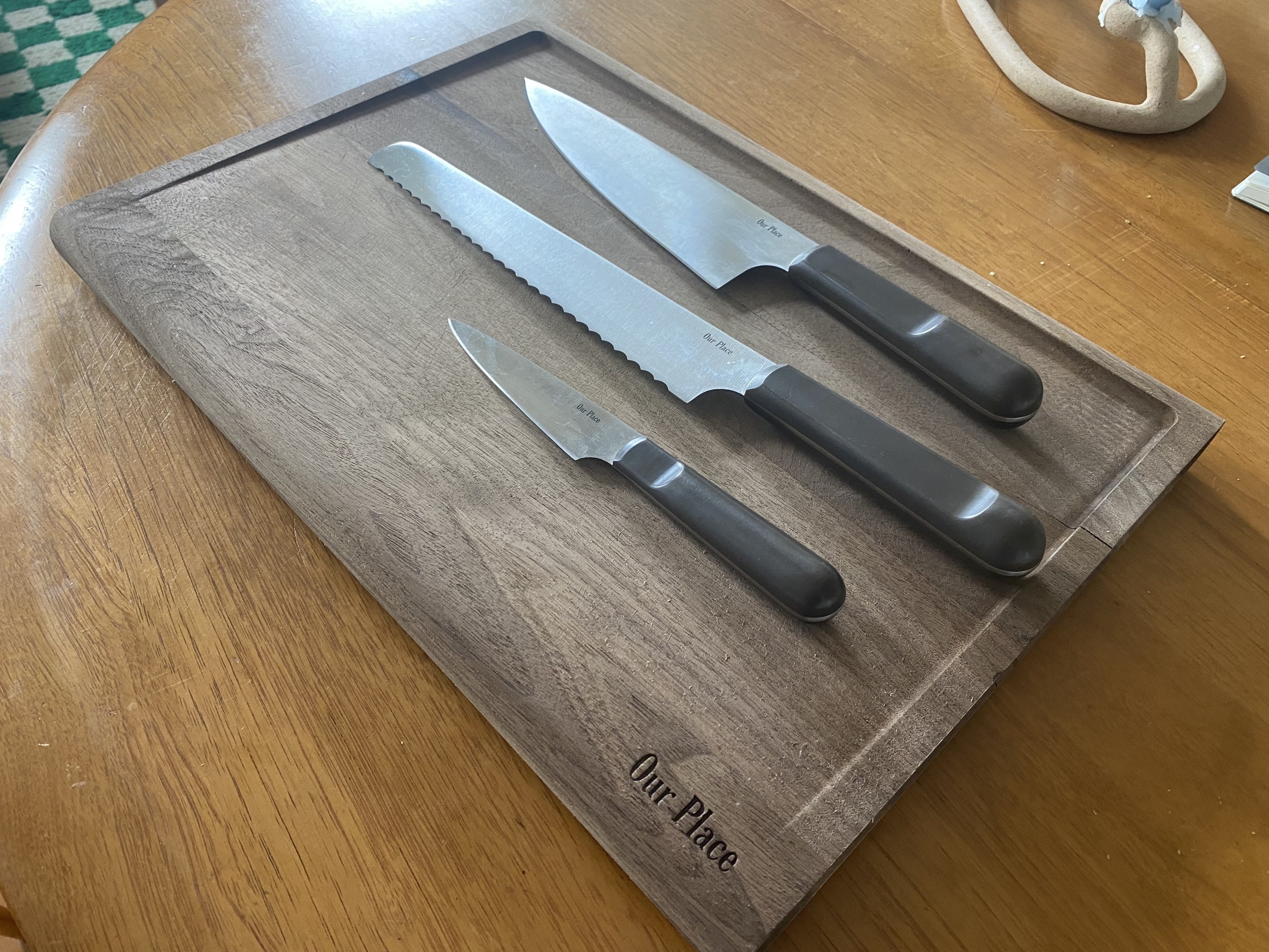 the three knives on the cutting board