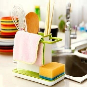 Sink caddy with a sponge, towel and other kitchen utensils in it