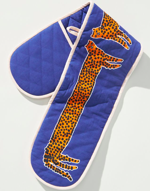 long fabric with two places for hands with two long leopards on it
