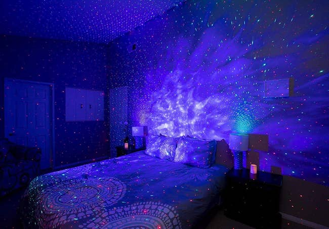 the blue and grey version of the galaxy light over a bed