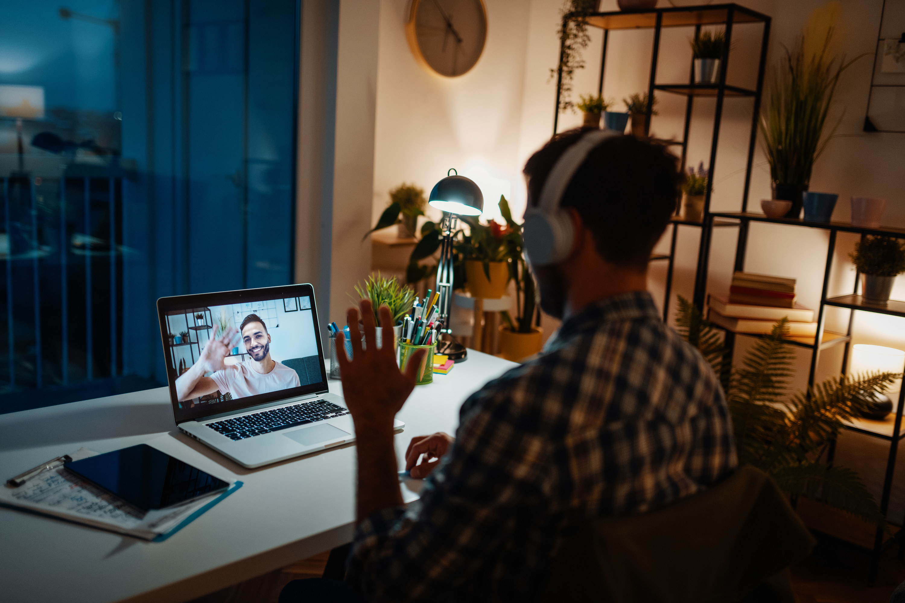 Person joining a video call for work after dark