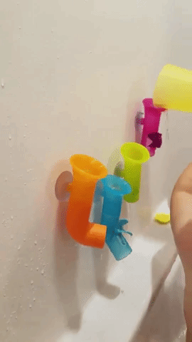 Reviewer&#x27;s video showing their child pouring water in the pipes at bath time
