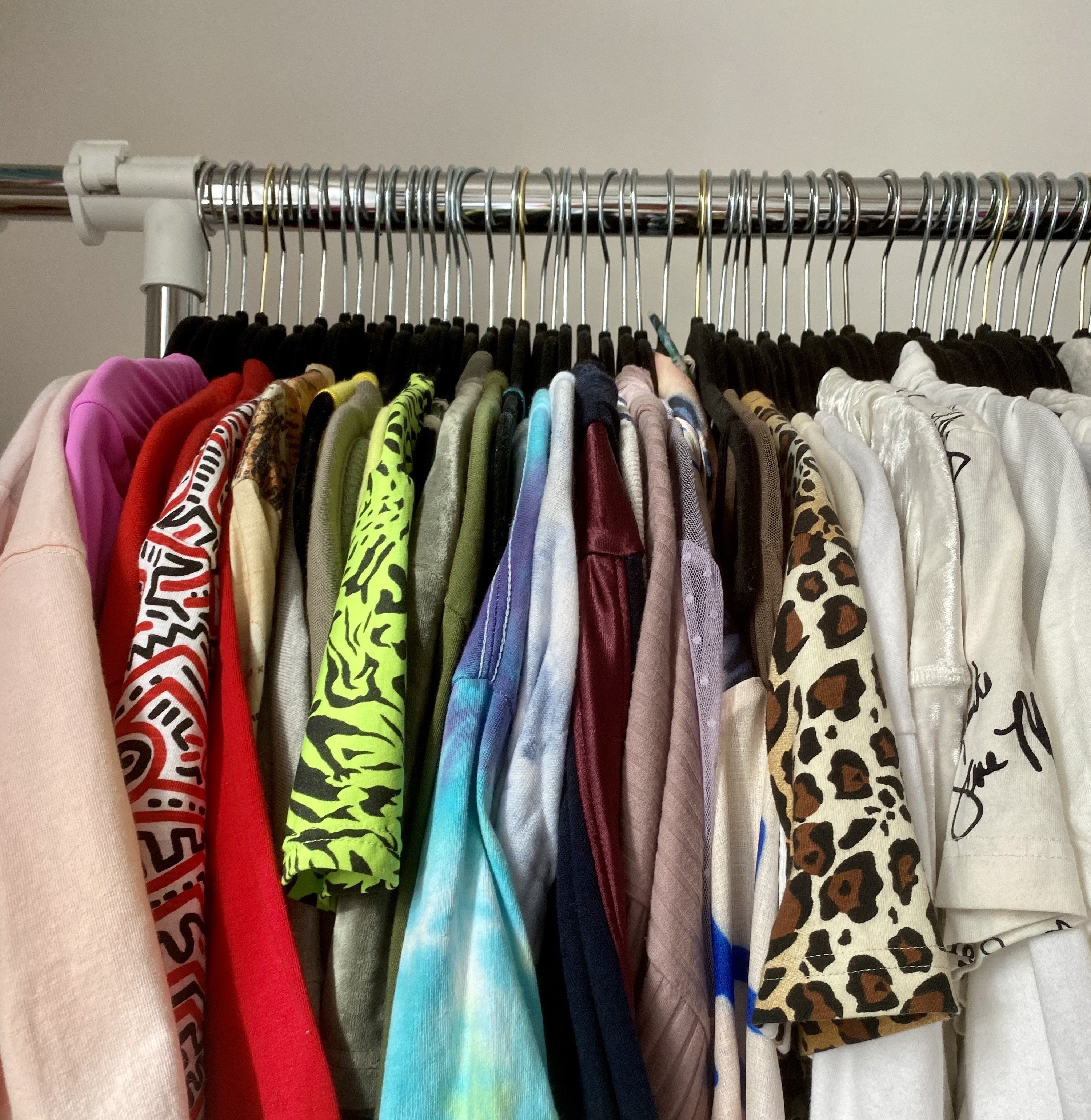 buzzfeed editor&#x27;s rack of clothes in rainbow order