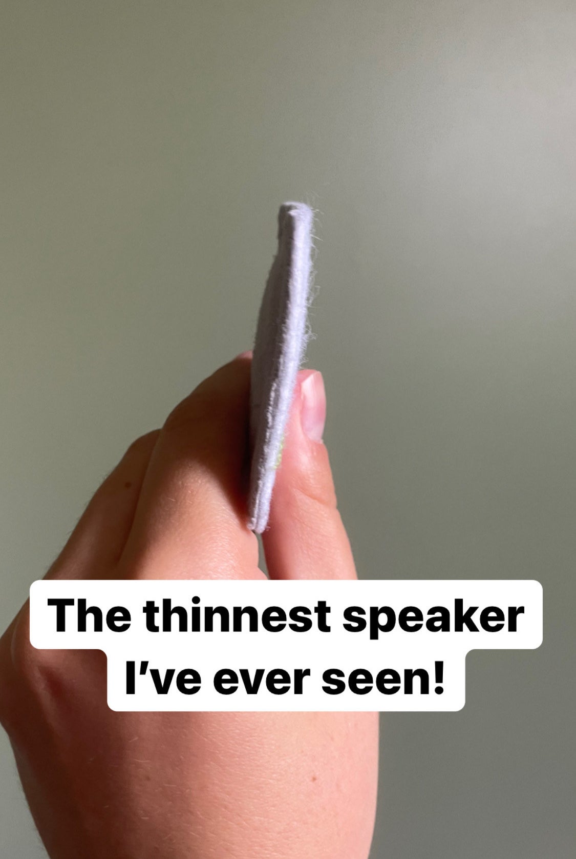 the writer showing the super thin speaker from the side captioned &quot;the thinnest speaker I&#x27;ve ever seen&quot;