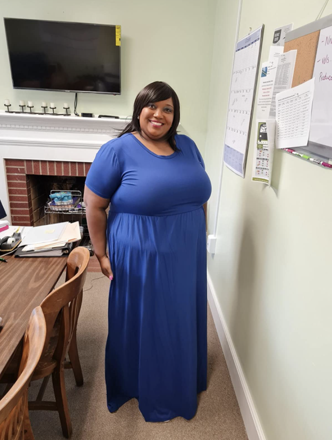 Reviewer wearing blue dress