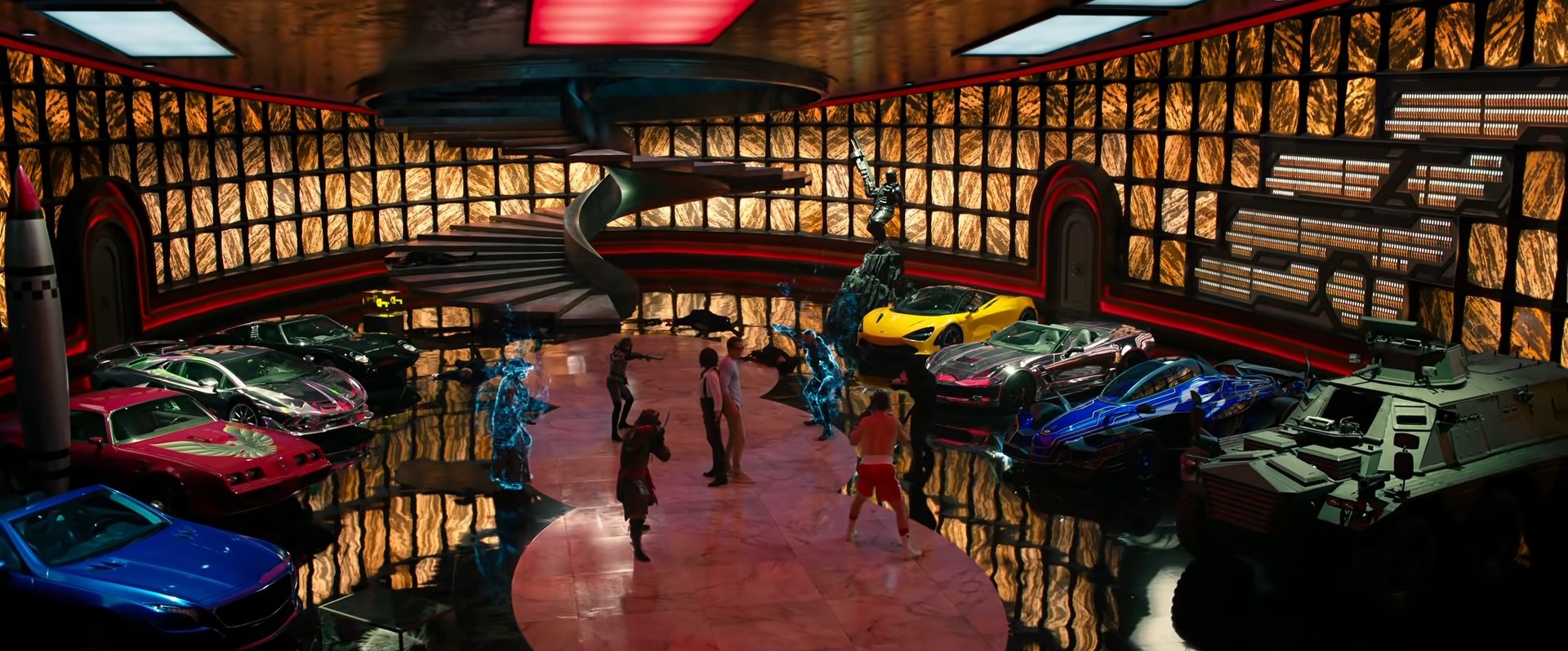 A hall of full of expensive cars and some people fighting with each other