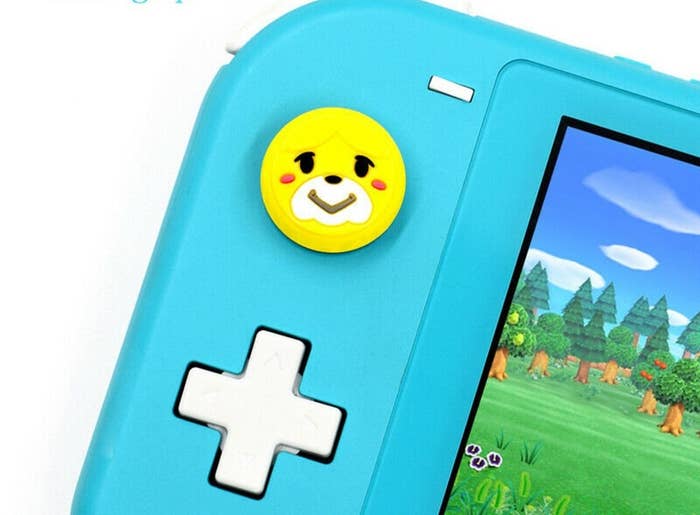 thumb grip shaped like the dog from animal crossing&#x27;s face