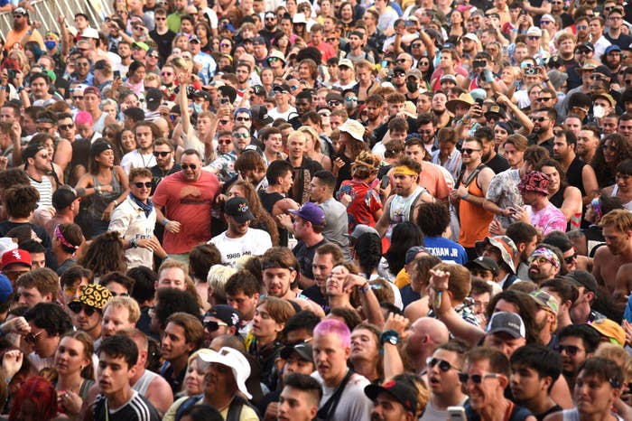 A crow of people at an outdoor music event