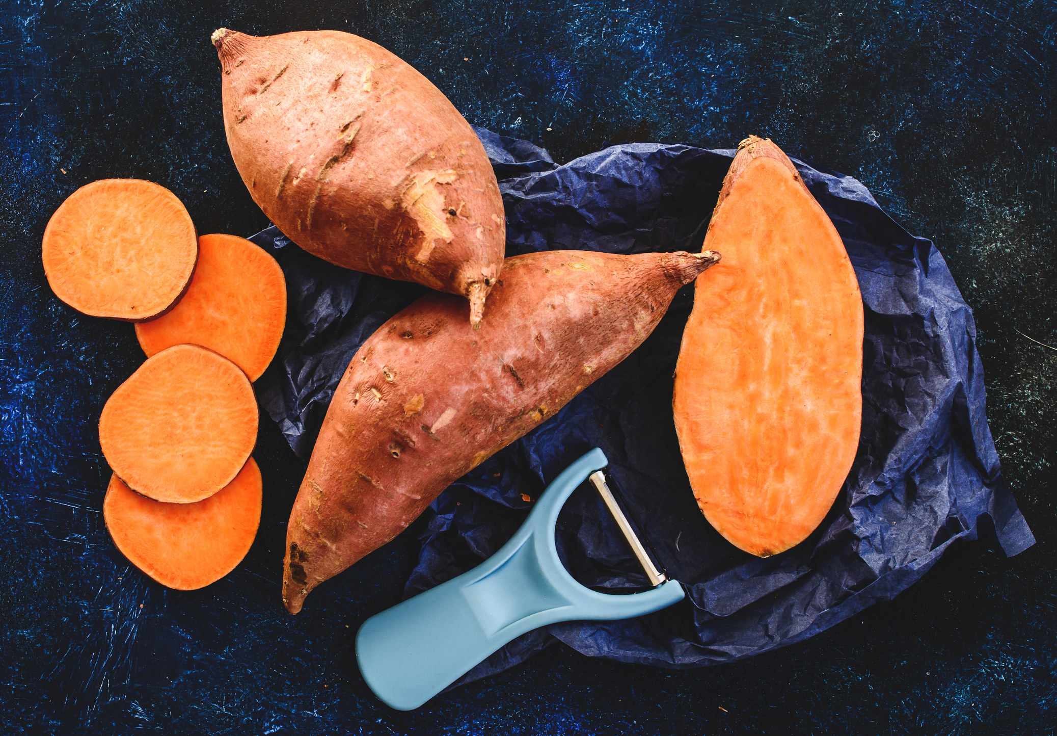 Sliced and whole sweet potatoes