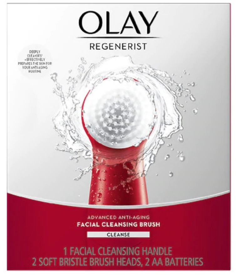 A red, facial cleansing brush