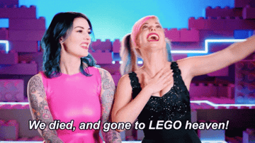 Two contestants on &quot;Lego Masters&quot; smiling and text &quot;We died, and gone to LEGO heaven!&quot;