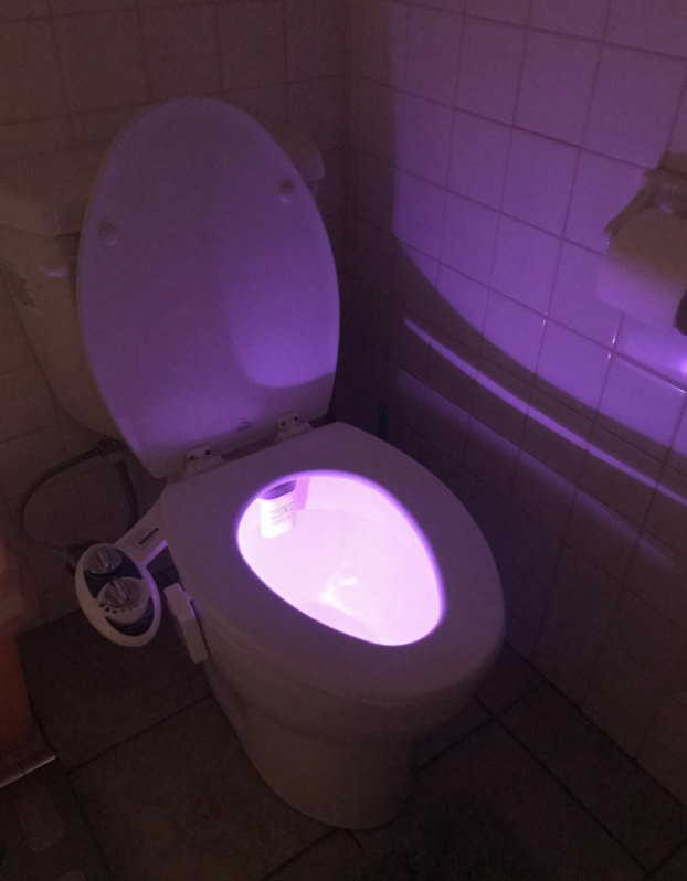 toilet with bowl lit up pink