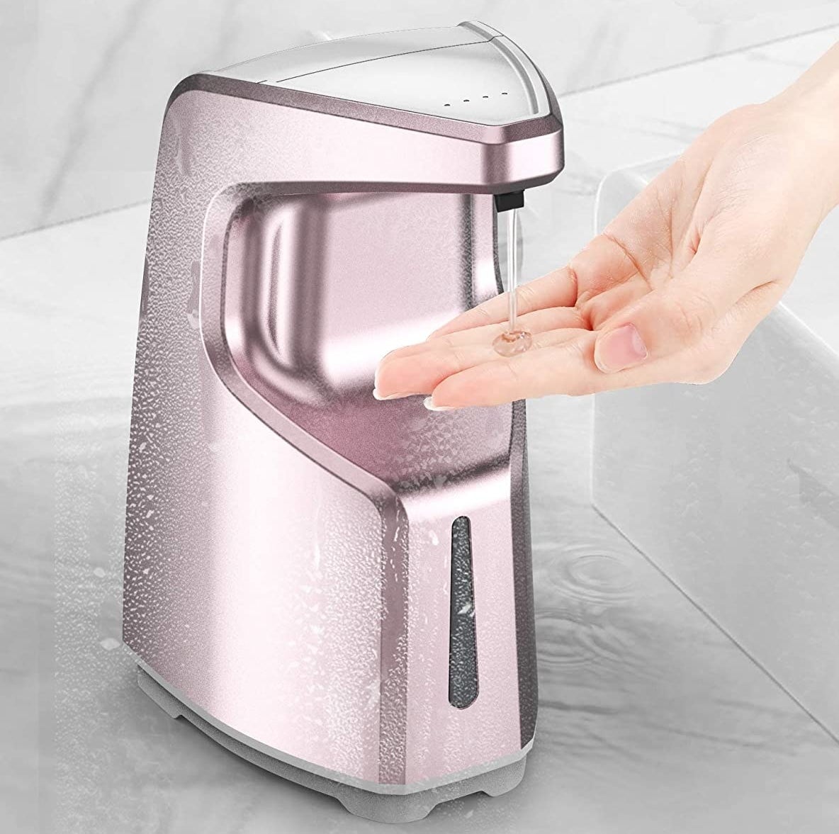 The dispenser dispensing soap into a person&#x27;s hand