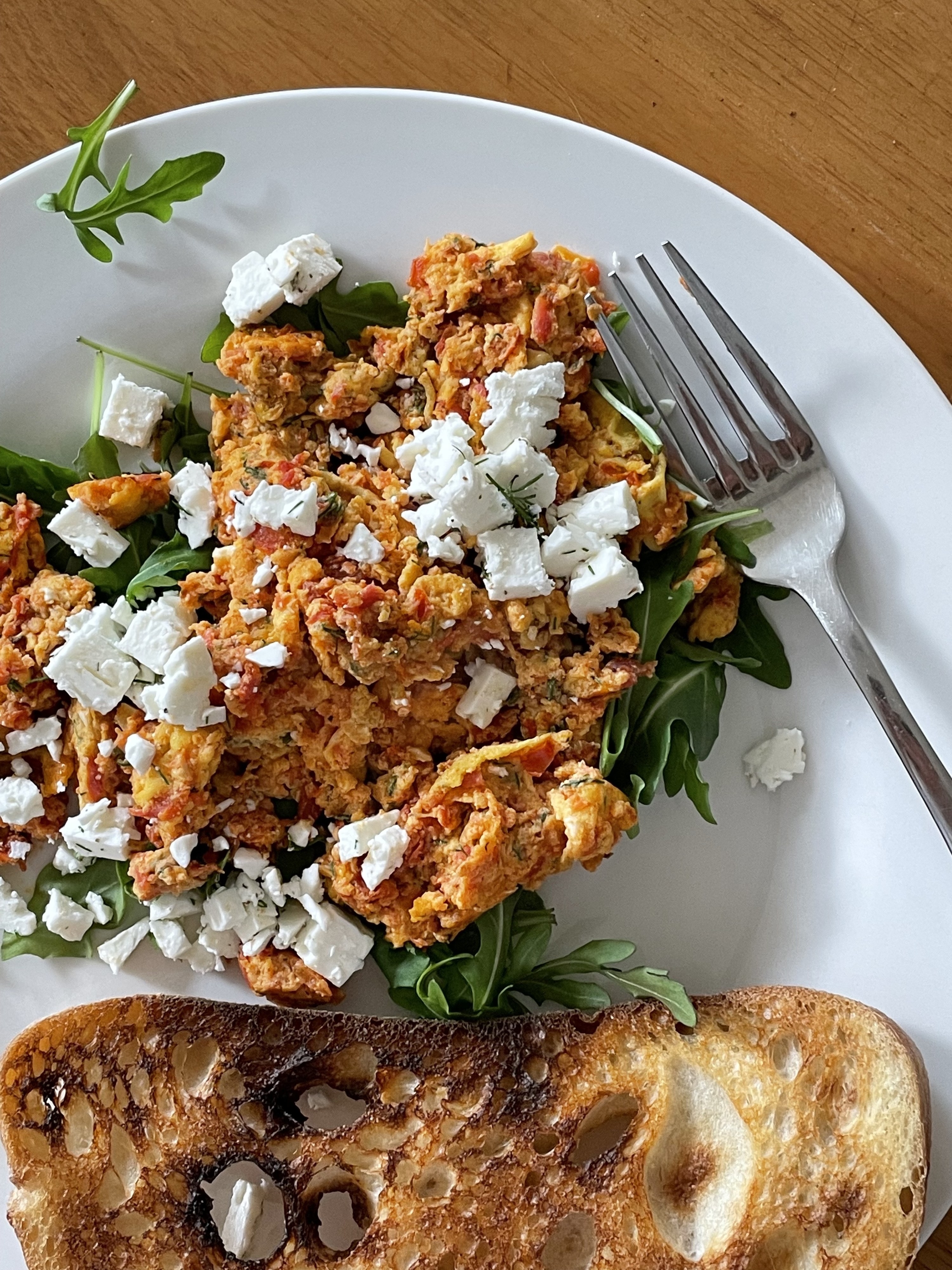 the greek eggs plated with feta and toast