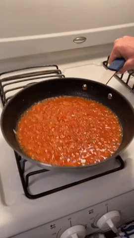 gif of the tomato sauce being swirled in the pan