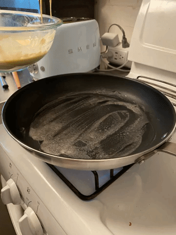 gif of the writer scooping pancake batter with a laddle into the pan