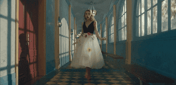 Taylor Swift walking down a hallway in her &quot;ME!&quot; music video