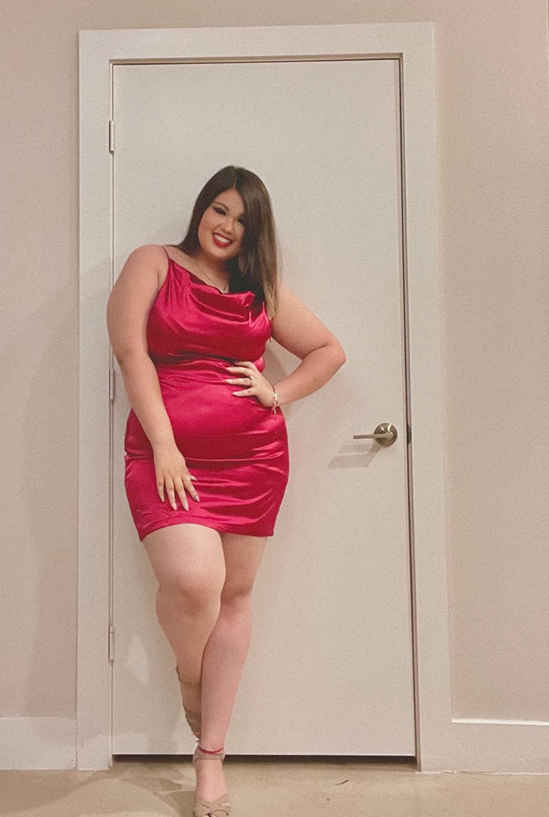 reviewer in red mini dress
