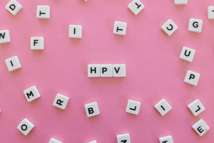 Block letters on a pink background spelling out &quot;HPV&quot;