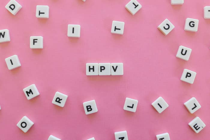 Block letters on a pink background spelling out "HPV"