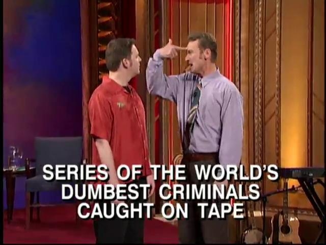 Brad and Ryan standing super close together with text reading, &quot;Series of the world&#x27;s dumbest criminals caught on tape&quot;