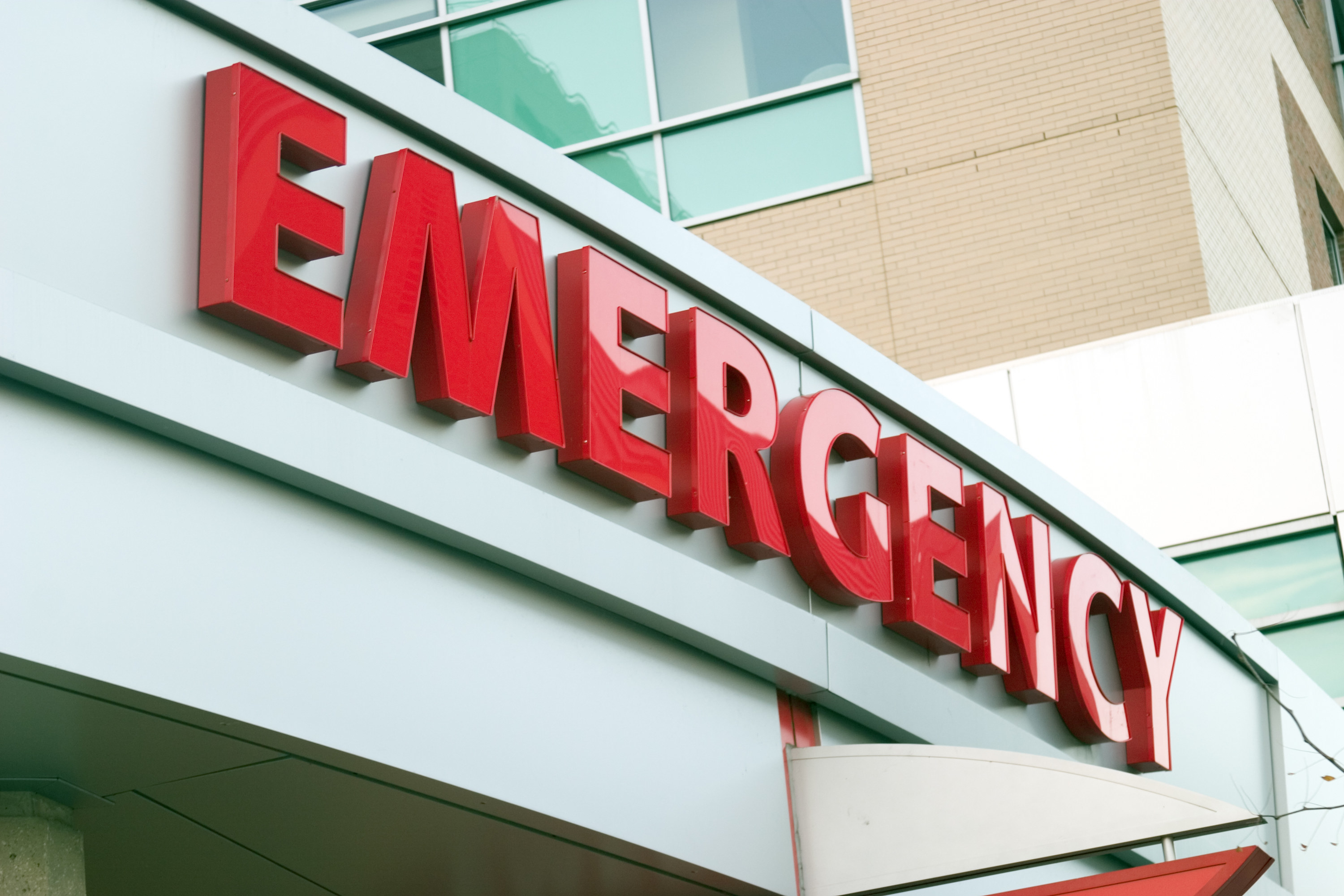 an emergency sign above a hospital entrance