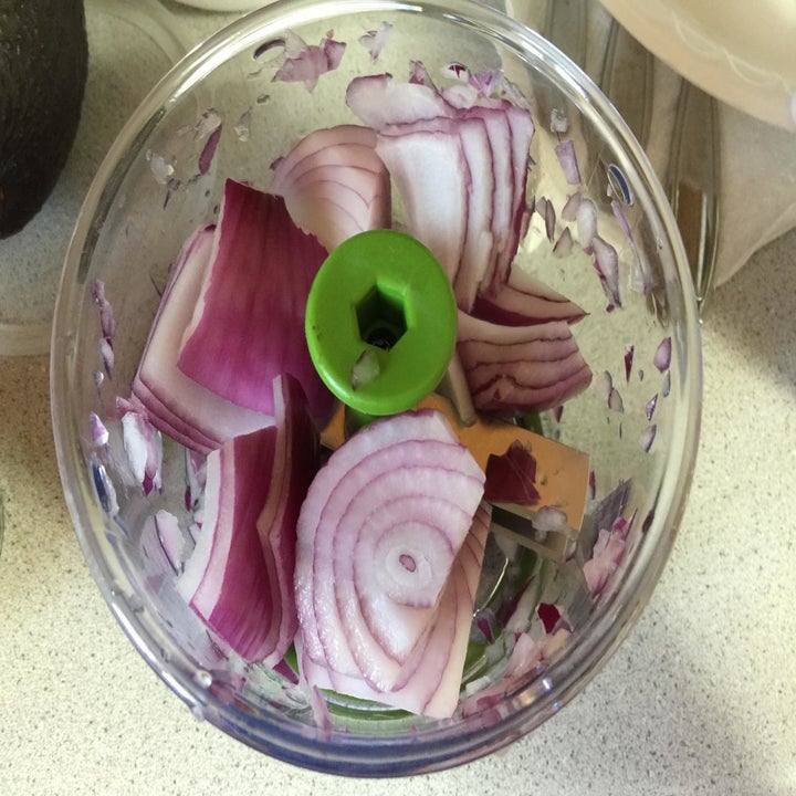 Reviewer veggie chopper with onions inside before being chopped