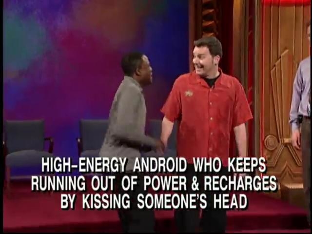 Wayne running up to Brad, trying to kiss him with text reading, &quot;High-energy android who keeps running out of power and recharges by kissing someone&#x27;s head&quot;