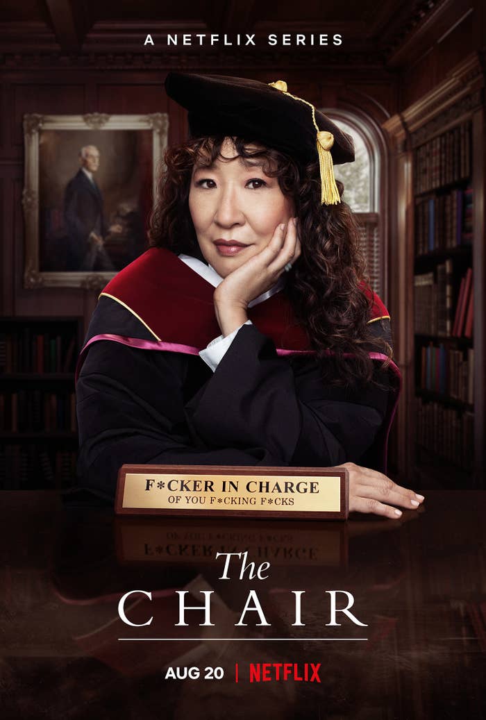 Promo image of Sandra Oh sitting at a desk with a plaque that says &quot;Fucker in charge of you fucking fucks&quot;
