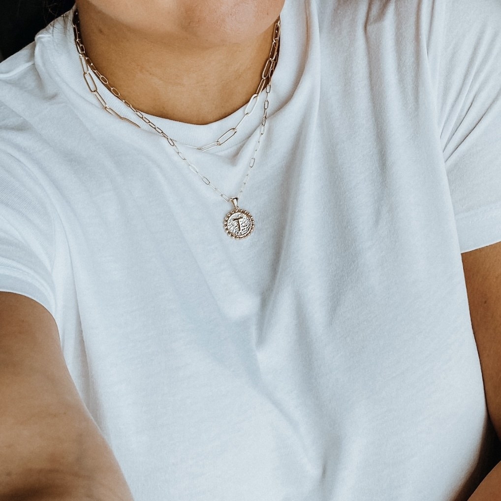 A reviewer wears the necklace in &quot;T&quot;