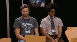 Characters from The IT Crowd giving each other a fist bump