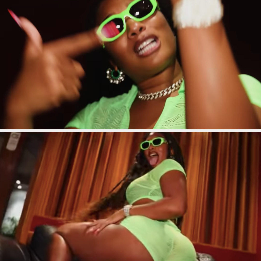 Megan is dancing in a neon crop top, matching booty shorts, sunglasses and diamond jewelry