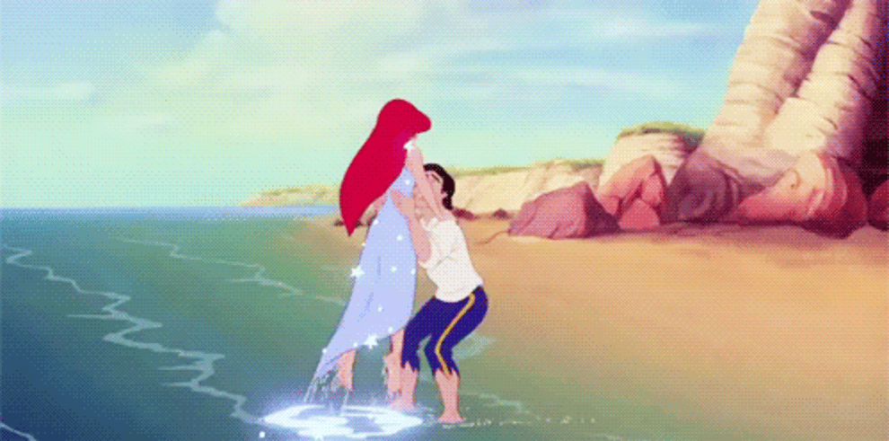 Prince Eric lifting Ariel from the ocean
