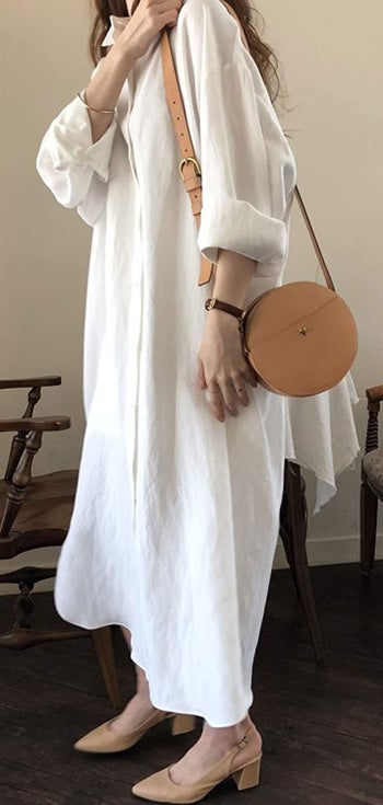 a model wearing the dress in white