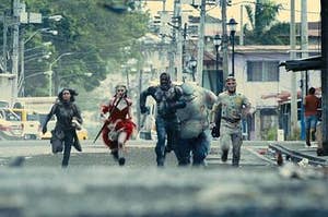 members of The Suicide Squad running toward Starro