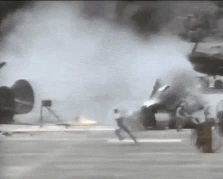Stuntpeople running from the crash