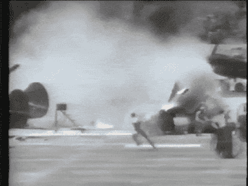 Stuntpeople running from the crash