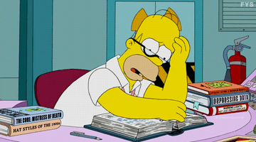 Homer Simpson reading books, looking stressed