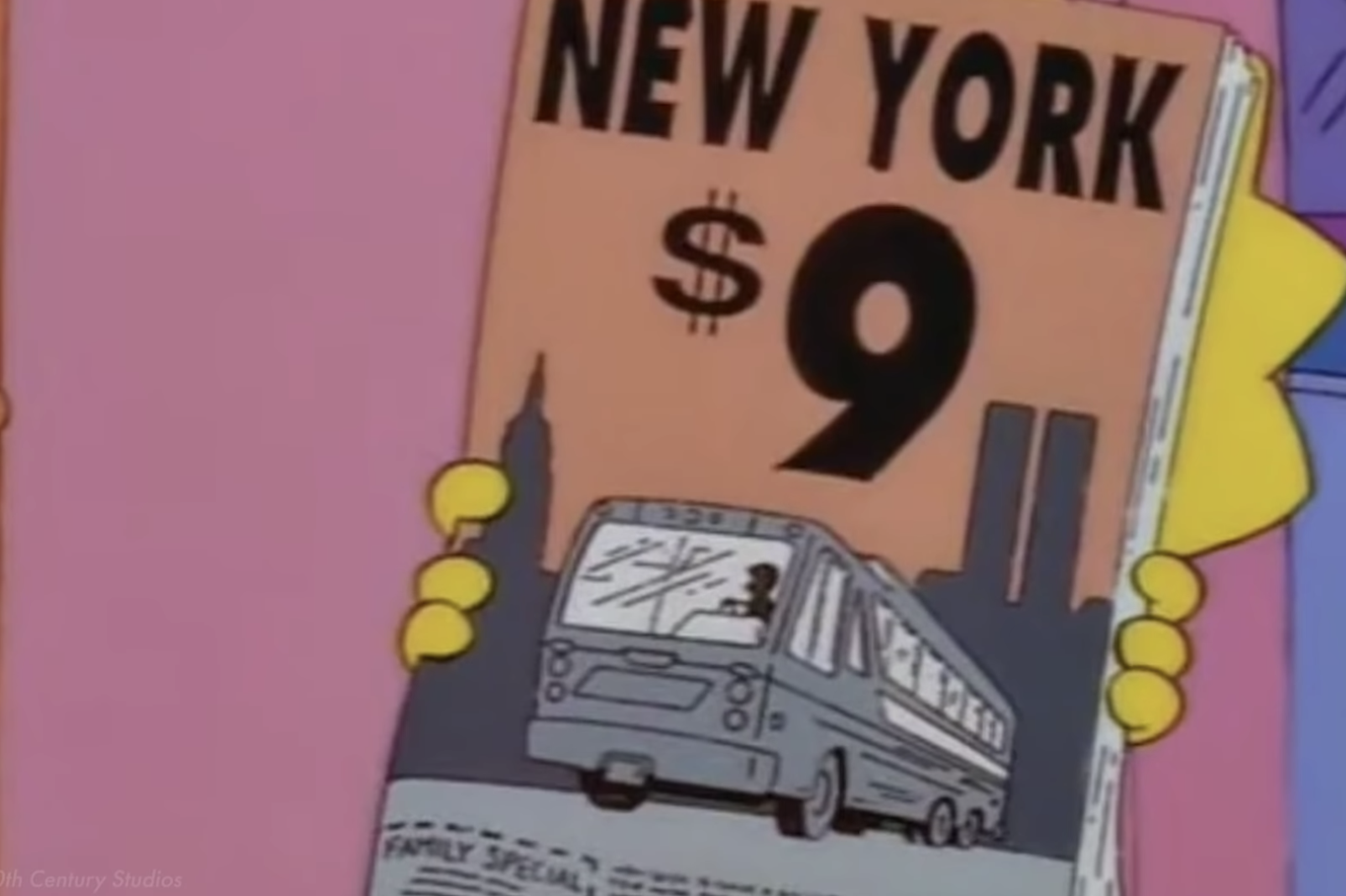 Lisa holding a brochure advertising something for $9 with the Twin Towers, looking like an &quot;11,&quot; in the background