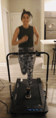 gif of me doing a light jog on the Treadly Pro 2 in my living room with the handrail up