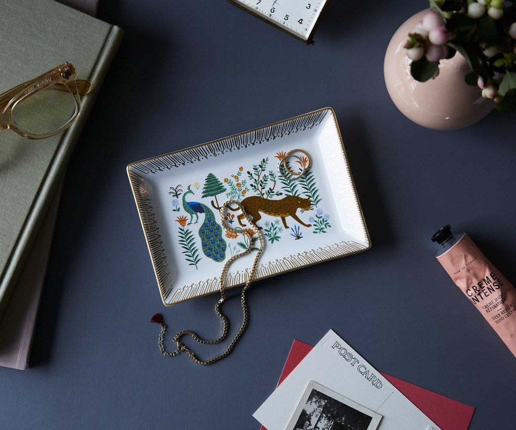 the catchall tray with gold edges, the two animals, and an array of florals