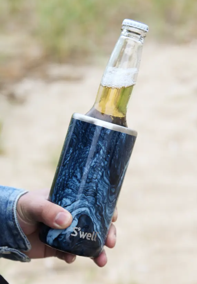 person holding beer inside swell chiller