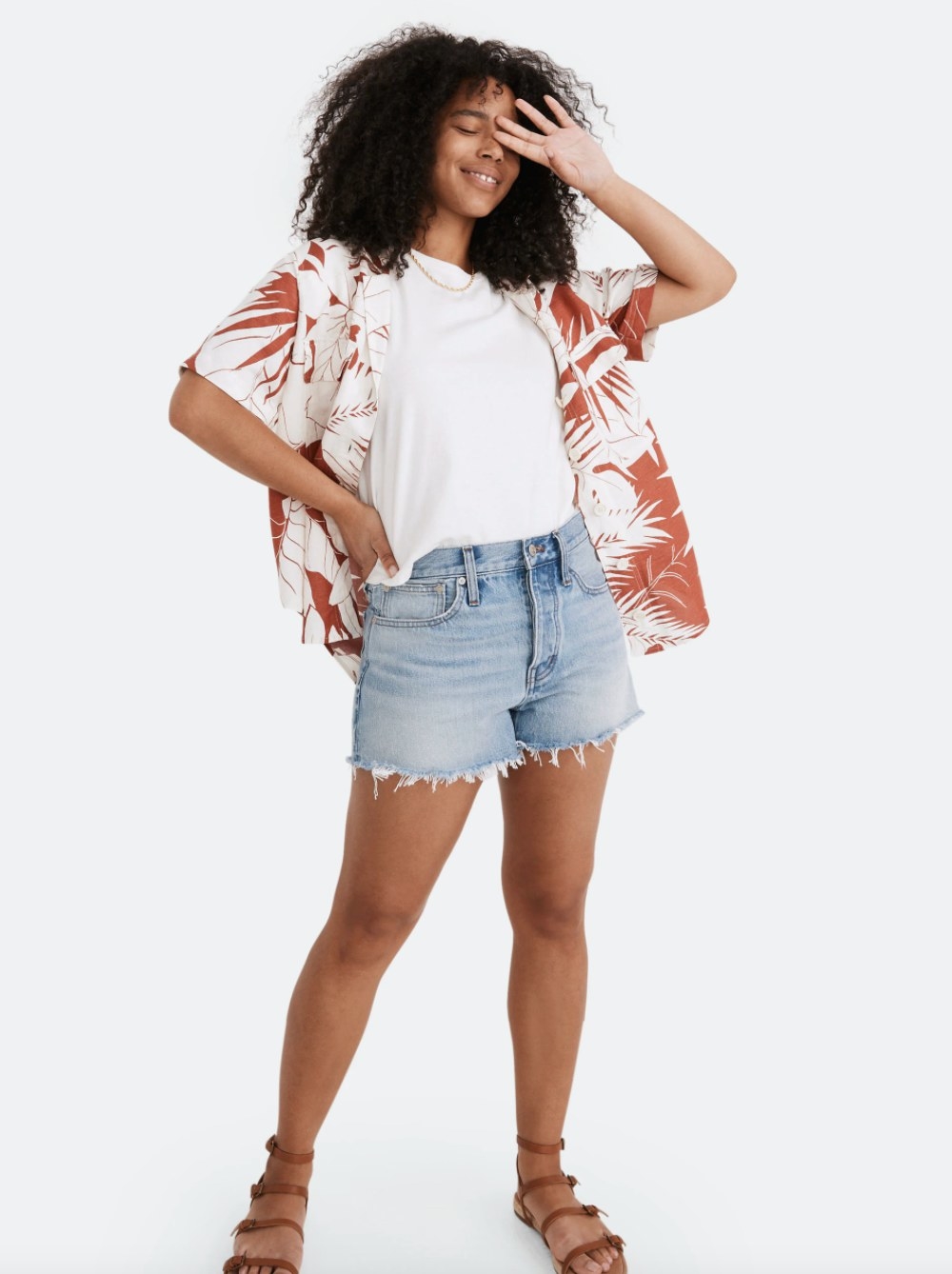the Madewell denim shorts on a model