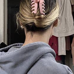 reviewer wearing the pink clip 
