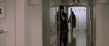 Andy entering the office after her makeover