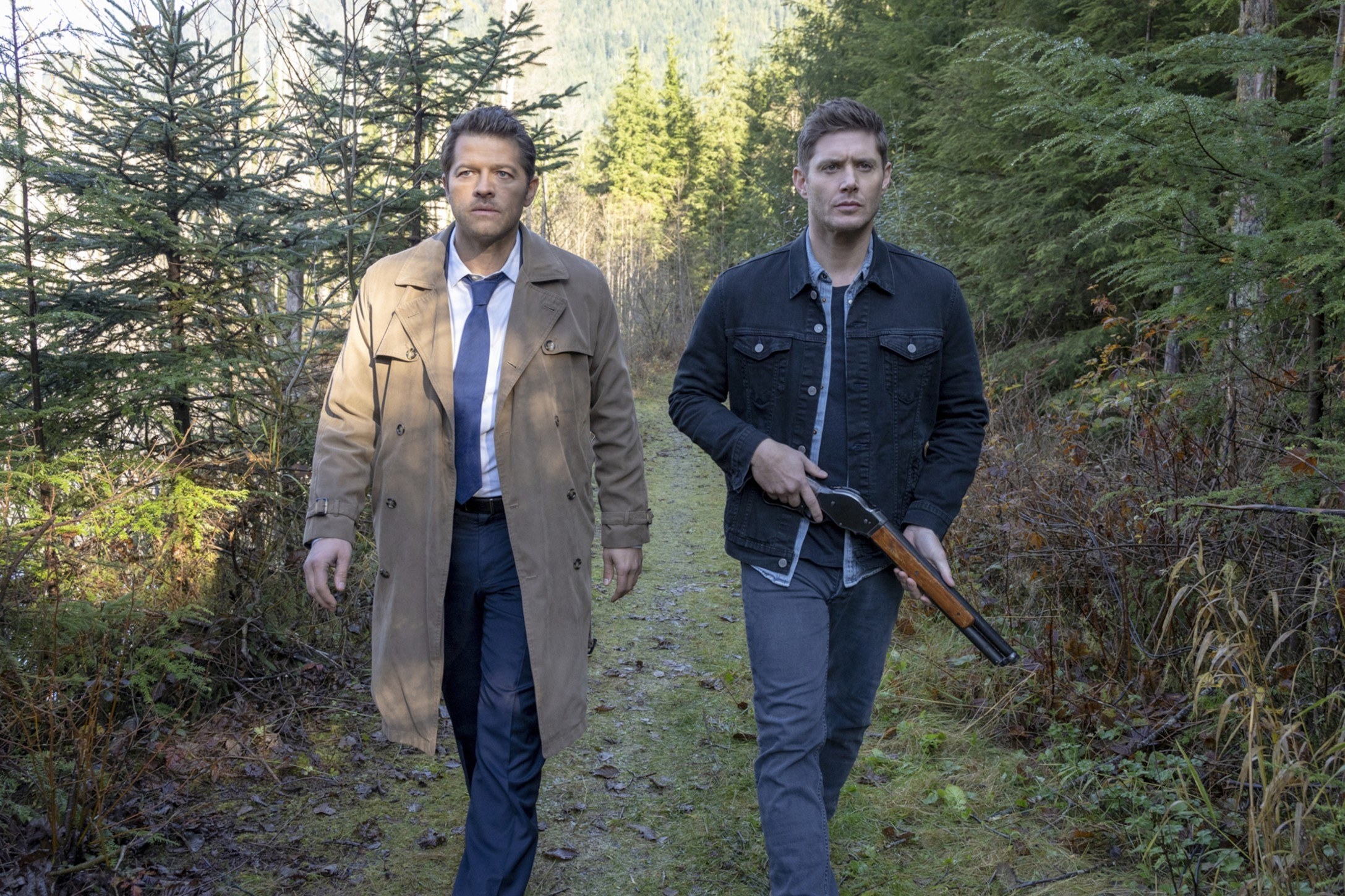 Misha Collins in a trench coat next to Jensen Ackles on &quot;Supernatural&quot;