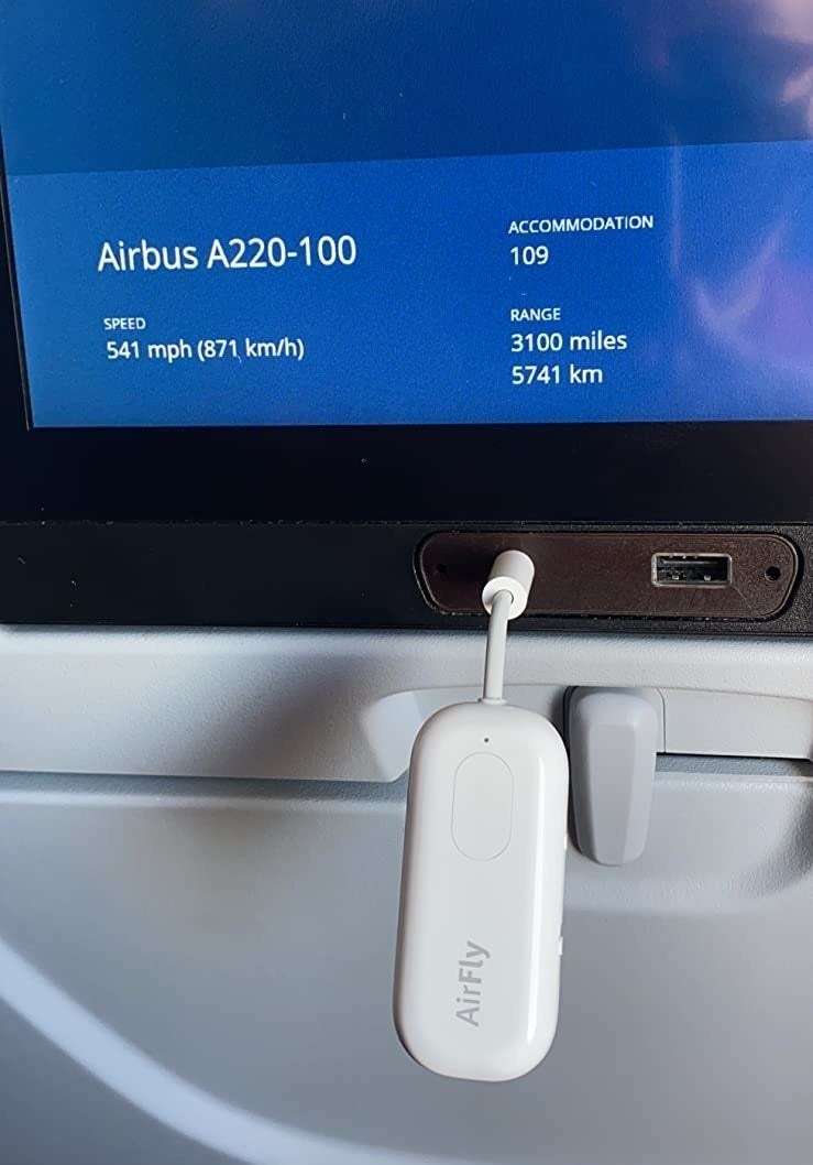 the AirFly Pro plugged into a screen on a plane