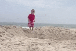 Kid dives in beach pit