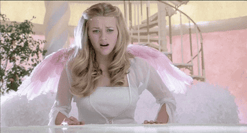 Reese Witherspoon wearing wings saying &quot;eww&quot;